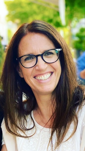 grayscale photography of two people raising their hands